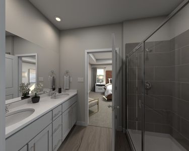 The ensuite bathroom features dual-vanity sinks and a walk-in closet.