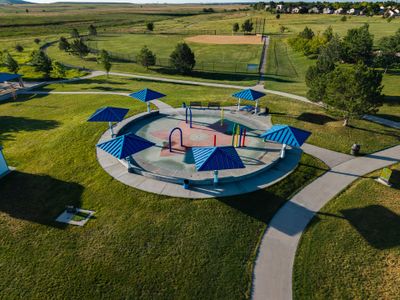 The Townes Collection at Harvest Crossing by Risewell Homes in Aurora - image