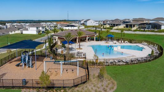 Ridgeview resort-style swimming pool with splash pad and cabana, and a shaded playground