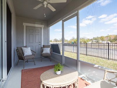 Your interior opens to outdoor living space on a private screened lanai, with an attached storage closet - Magnolia townhome in Plant City, FL