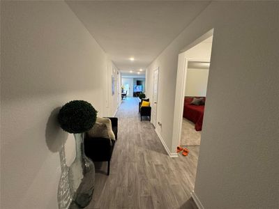 Corridor featuring hardwood / wood-style floors