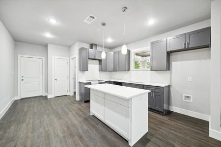 Large kitchen island in kitchen with tons of cabinetry