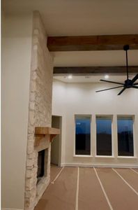 You will love the wood floors, stone on the fireplace and strong beams.