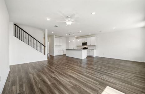 Airy gathering room with large windows *real home pictured