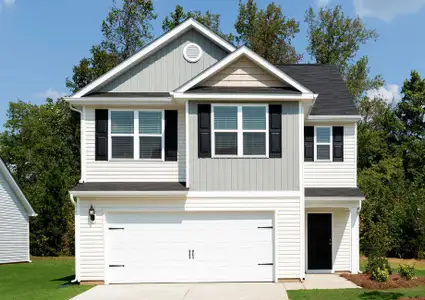 Two-story exterior of the Burke with shutters.