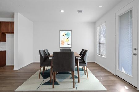 Make memories gathered around the table with your family and friends! This dining room features high ceilings, recessed lighting, large window with privacy blinds, and gorgeous vinyl plank flooring!