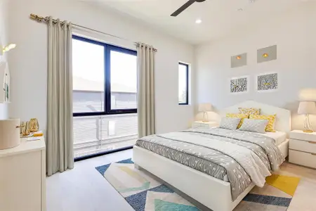 Bedroom with ceiling fan and light hardwood / wood-style flooring