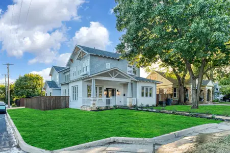 View of front of property with a front yard and a porch