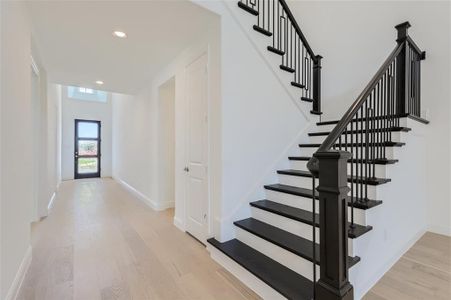 Stairway with light wood-type flooring