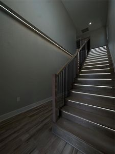 Staircase with hardwood / wood-style flooring