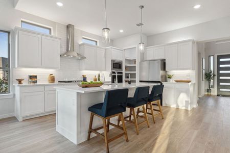 Kitchen in the Monet II home plan by Trophy Signature Homes – REPRESENTATIVE PHOTO