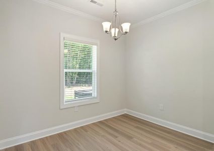 Dining area with vinyl floors.