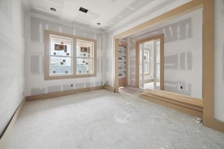 Another view of the dining room from the butler's pantry looking toward the front door, entry way and home office.