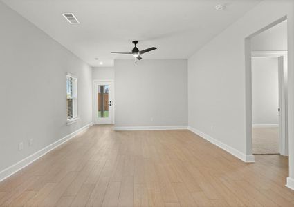 The family room of the Cedar has plenty of space for furniture.