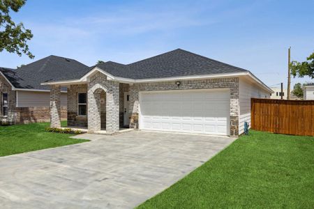 View of front of house with a garage and a front lawn