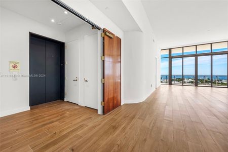 Private Elevator & Foyer Entrance through Private Double French Doors