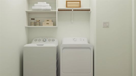 Laundry room with washing machine and clothes dryer