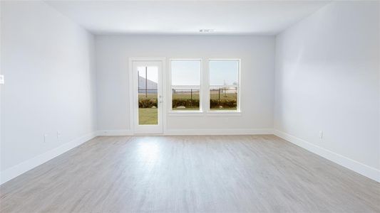 Unfurnished room with light hardwood / wood-style flooring