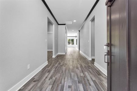 Welcome inside your gorgeous new home! Look at this extra wide, grand entry!!! To the right is your garage entrance, mud room and one of 2 entrances into your laundry room. on the left is entry into your secondary bedrooms, both of which have entry in to full baths. Bedroom #2 has bedroom into bathroom shared by hall and Bedroom #3 has its very own private full bath. Straight ahead is your main living area.