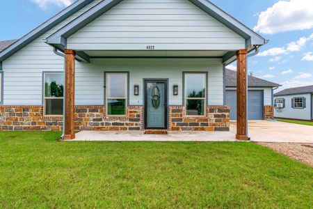 Large covered front patio perfect for early mornings with a cup of coffee.