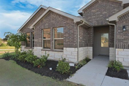 Covered Front porch and landscaped yard