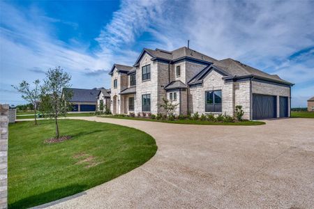 View of property exterior featuring a garage and a yard