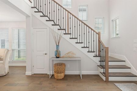 Front entry and stairway bathed in natural light