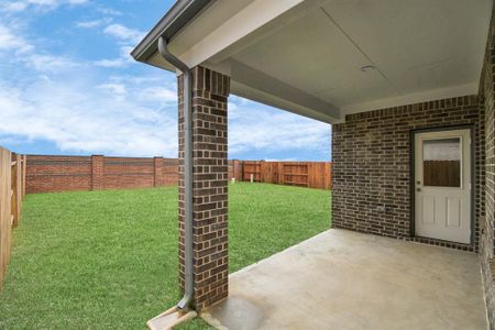 Explore the expansive backyard with its inviting covered patio—a perfect blend of space for the kids to play and adults to unwind. Ideal for creating your outdoor oasis, this backyard accommodates patio furniture, a BBQ pit, and endless possibilities for leisure and entertainment. Sample photo of completed home with similar floor plan. Actual colors and selections may vary.