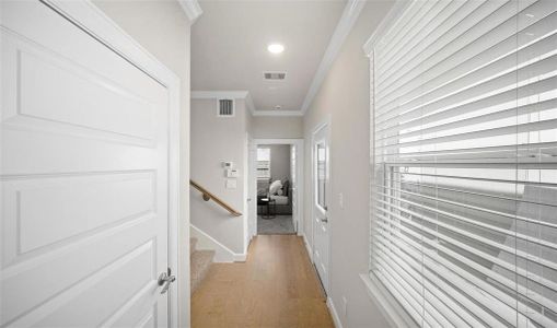 Upon entry, you will noticed recessed lighting, crown molding, engineered wood flooring, and modern doors. The home features natural lighting from the double paned windows.