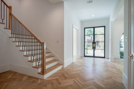 Entryway with light parquet floors