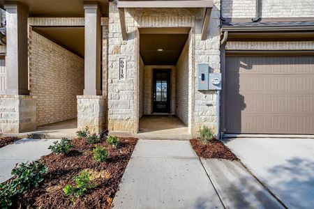 Property entrance with a garage