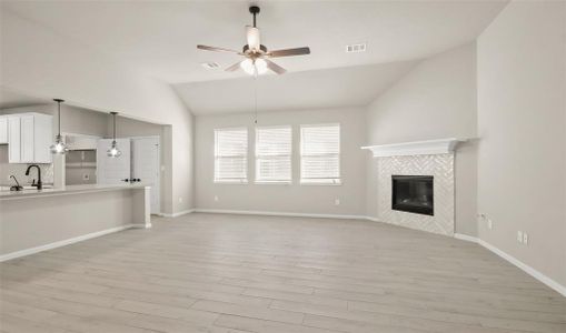 Cozy great room with fireplace (*Photo not of actual home and used for illustration purposes only.)