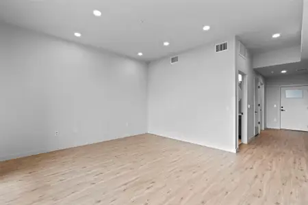 Spare room featuring recessed lighting, visible vents, baseboards, and light wood-style flooring