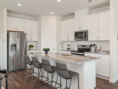 The well-appointed kitchen with a large island makes meal prep a breeze.