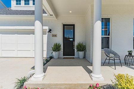 Property entrance with a garage