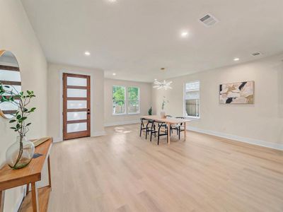 Dining room featuring a chandelier and light hardwood / wood-style floors