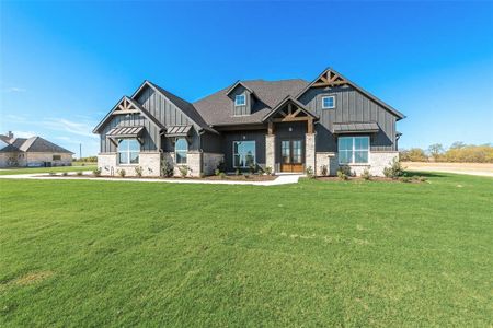 Craftsman house with a front lawn