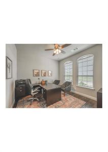 Office area with ceiling fan and dark hardwood / wood-style flooring