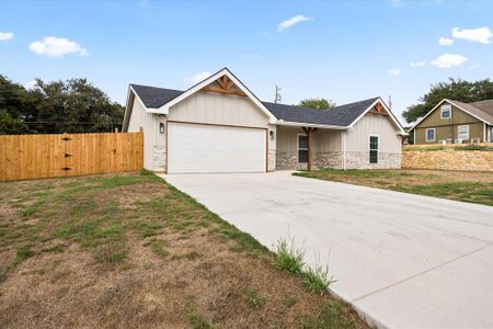 View of front facade with a garage and a front yard