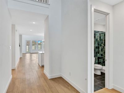 Corridor featuring hardwood / wood-style floors