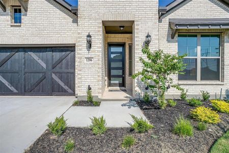 Property entrance with a garage