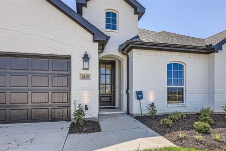 Entrance to property with a garage