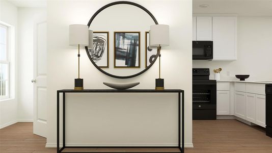 Details featuring black appliances and hardwood / wood-style floors