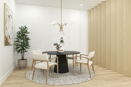 Dining area featuring light wood-type flooring and a notable chandelier