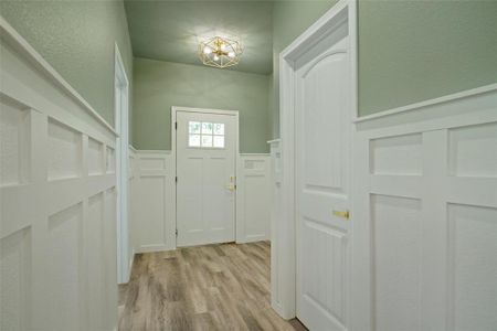 Doorway to outside featuring light hardwood / wood-style floors