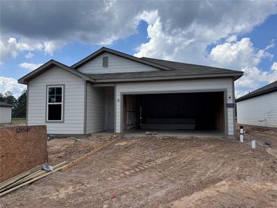 New construction Single-Family house 10746 Red Flagstone Drive, Conroe, TX 77306 WREN- photo 0