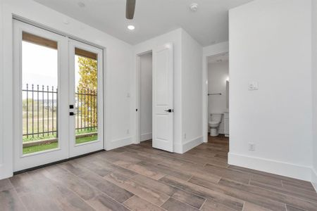 **THIS PHOTO IS OF A PREVIOUS BUILT HOME** THIS HOME WILL BE THE SAME FLOORPLAN BUT WILL HAVE DIFFERENT FINISHESThe downstairs bedroom could be an office.  It has a walk-in closet, bathroom and leads out to the turf and gravel backyard.