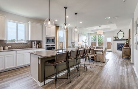 Spacious island kitchen with pendant lighting