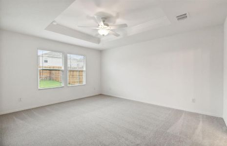 Elegant owner's suite with Tray ceiling *real home pictured