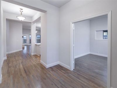 Hall featuring dark wood-type flooring